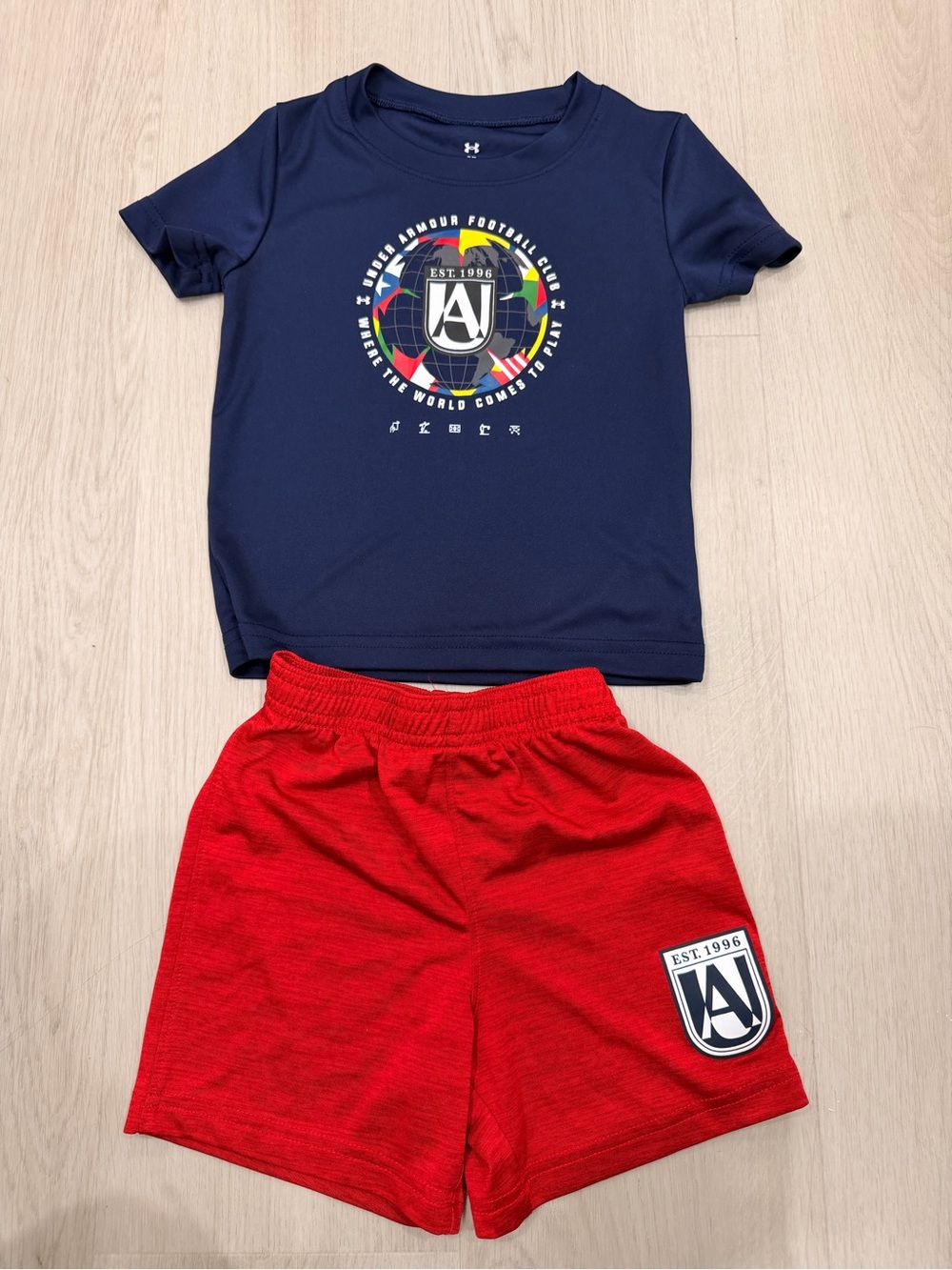 Under Armour Navy Graphic Tee with Multicolor Crest & Red Athletic Shorts